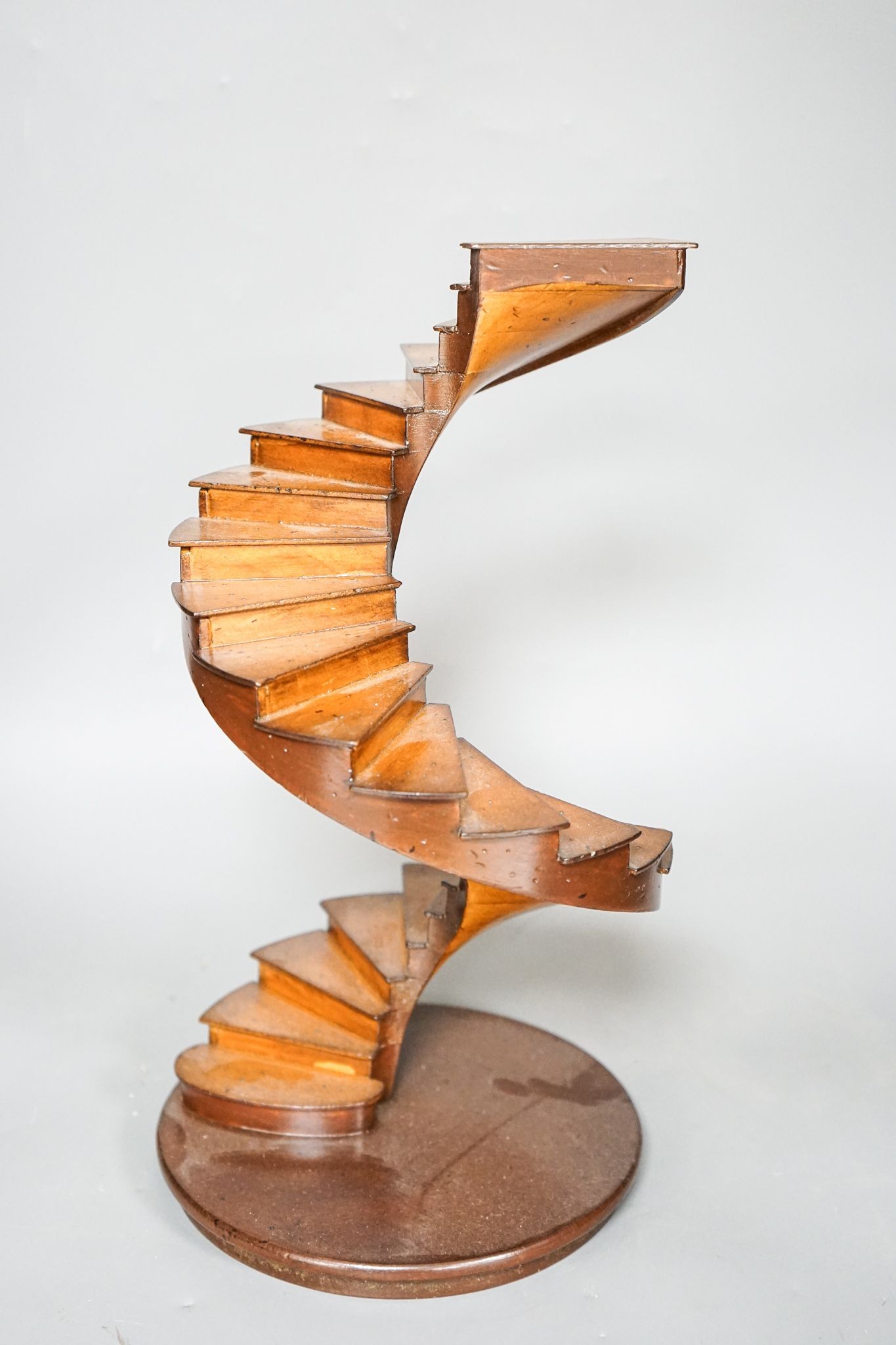 A small wood model spiral staircase together with a section of plaster frieze work (2) 37cm